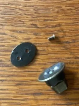 Small hardware pieces on table