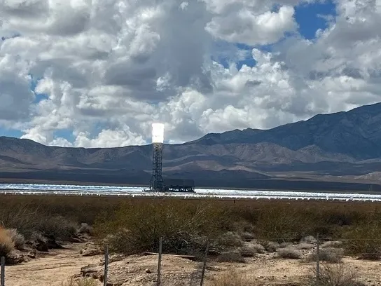 Solar energy plant with mountains in background
