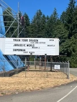 Outdoor cinema sign with movie titles