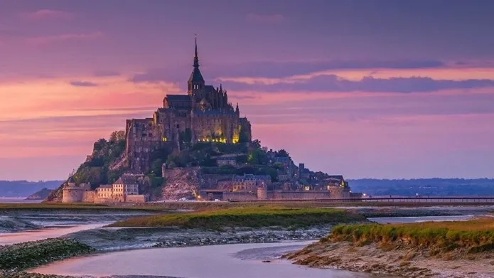 Medieval island abbey at sunset