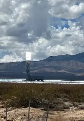 Solar energy plant with mountains in background